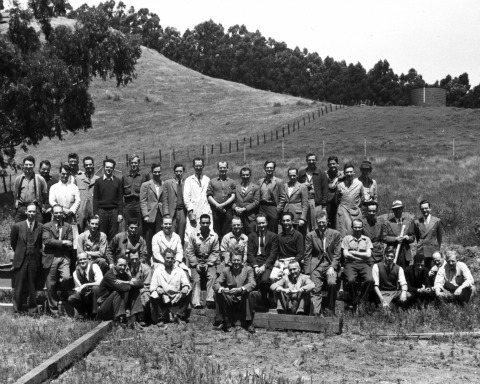 Hubert P. Yockey (farthest left in the last row, wearing a sweater), with Berkeley Radiation Lab Director Ernest Lawrence (front row, center, sitting on railroad tie) and Associate Director, Donald Cooksey (on Lawrence's left), at the site of the 184-inch cyclotron in 1942. Dad just told me he's wearing jeans because he hiked up to the site.